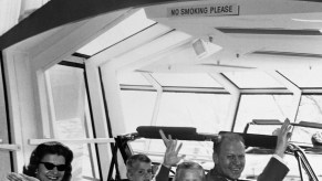 exhibitors riding the Ford and Walt Disney Magic Skyway in a Mustang at the 1964 World's Fair in New York City