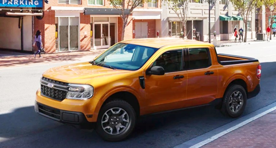 A yellow 2022 Ford Maverick small pickup truck is parked.