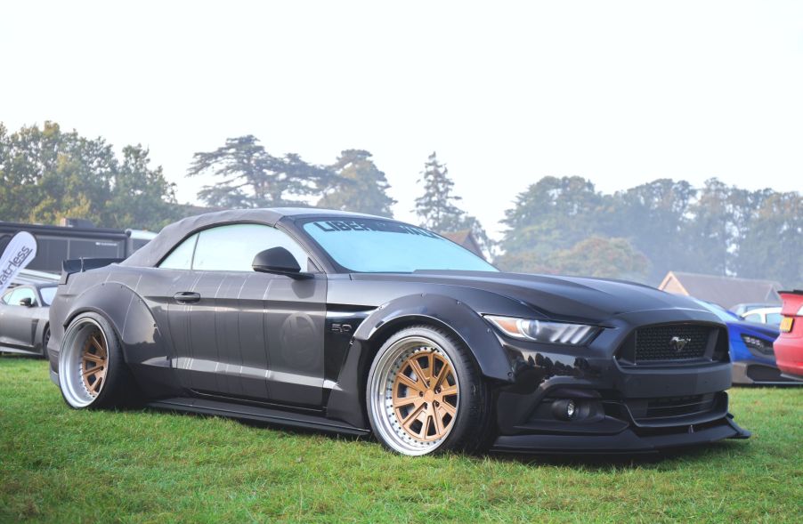 A black Ford Mustang Coupe, included as one of the best used sports cars.