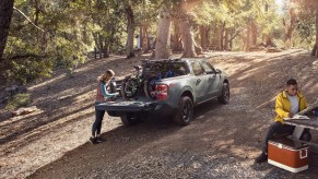 A 2022 Ford Maverick demonstrates its off-road capability as a compact truck.