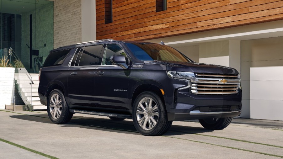 Front angle view of dark blue 2023 Chevy Suburban, highlighting its release date and price