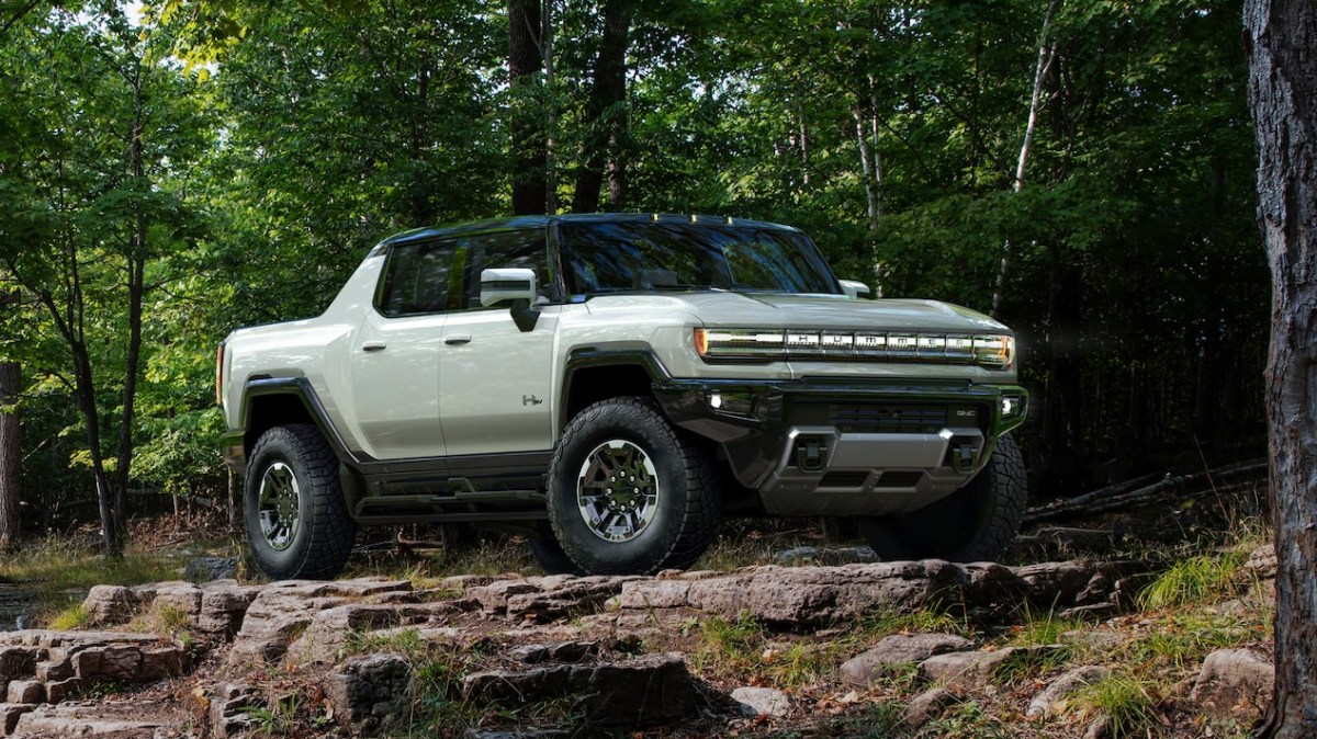 Front angle view of silver 2022 GMC Hummer EV Pickup, a truck with a 0-60 mph acceleration time of 3 seconds