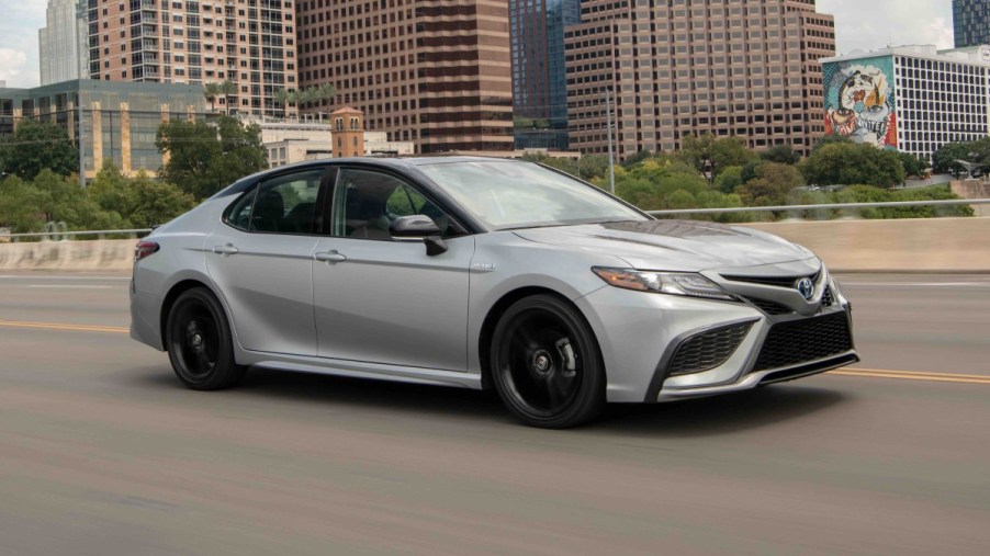 Front angle view of silver 2022 Toyota Camry Hybrid, one of the best cars for Uber and Lyft drivers in 2022