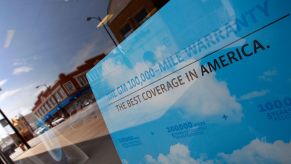 A General Motors extended warranty banner seen in the window of Roseland Pontiac in Chicago, Illinois