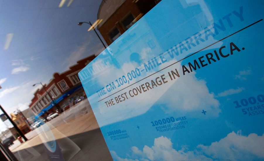 A General Motors extended warranty banner seen in the window of Roseland Pontiac in Chicago, Illinois