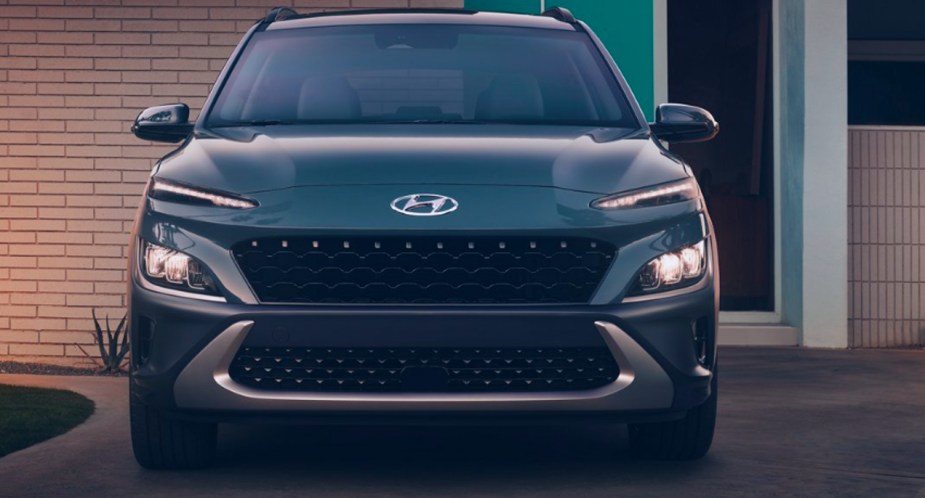 A blue 2022 Hyundai kona cheap SUV is parked.