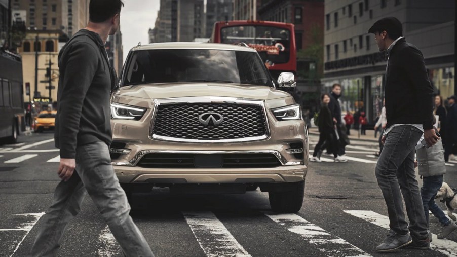 A beige 2022 Infiniti QX80 in the city.