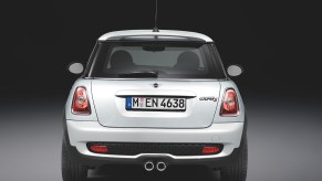 The rear of a white 2009 Mini Cooper S.