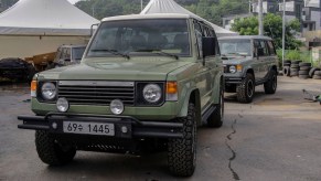 Two restored Mitsubishi Pajero SUVs.