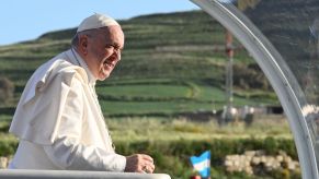 Pope Francis riding in the popemobile after auctioning off his gift of a Lamorghini Huracan