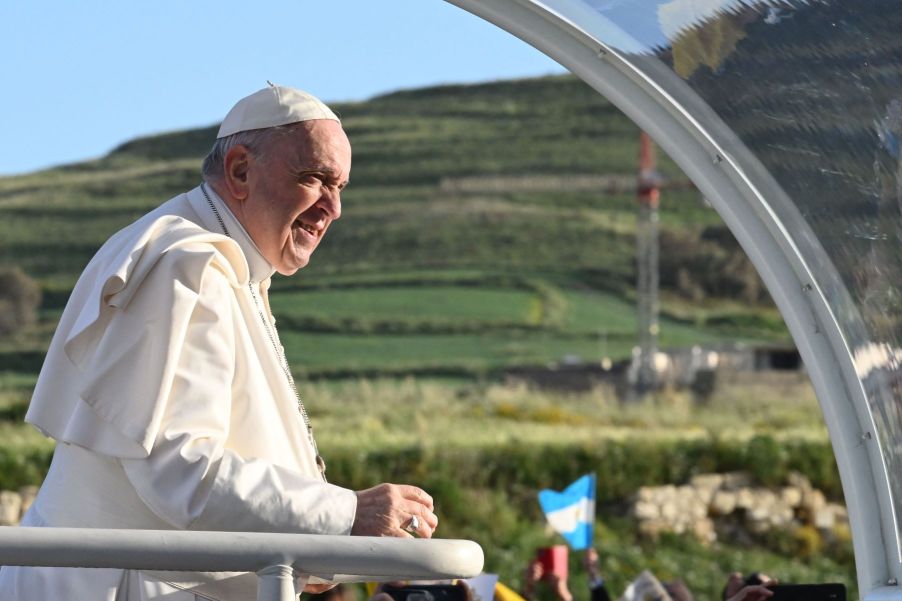 Pope Francis riding in the popemobile after auctioning off his gift of a Lamorghini Huracan