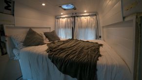 The bedroom of a Freightliner Sprinter High Top van as one RV mattress option