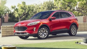 Rapid Red 2022 Ford Escape parked outside of a garage