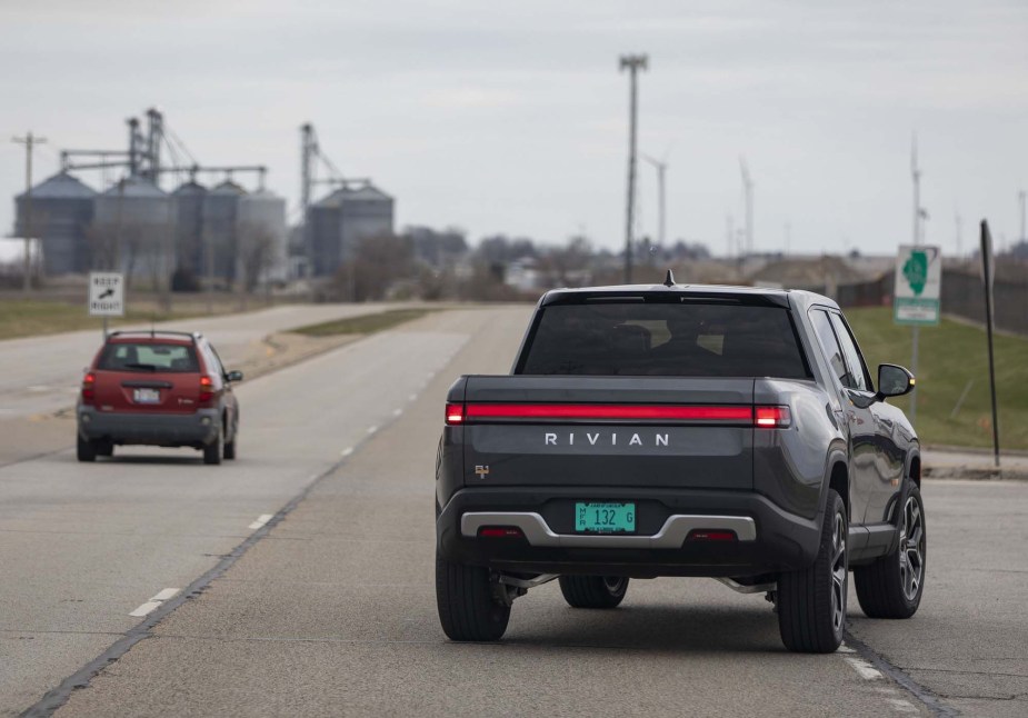 Rivian R1T, potentially a Rivian R1T exterior issues, driving down the road. 