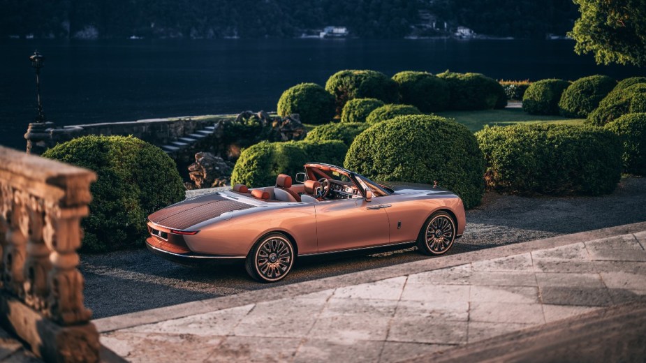 the beautiful and elegant rolls-royce boat tail basking in the sun set