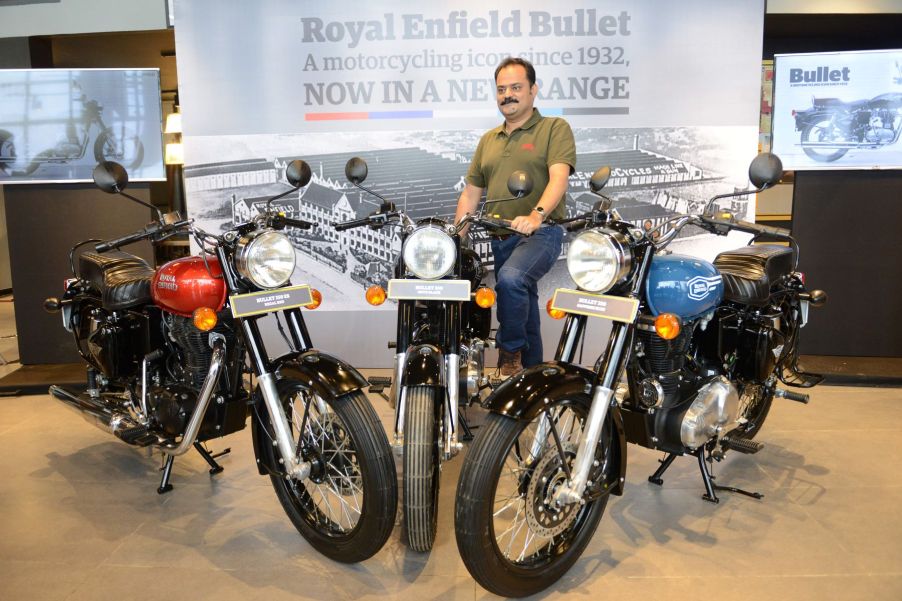 Royal Enfield Global Head of Brand Shubhranshu Singh posed with Bullet motorcycle models in Amritsar, India