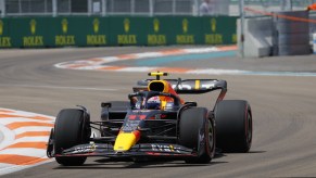 Sergio "Checo" Pérez's Formula One car circling a race track.