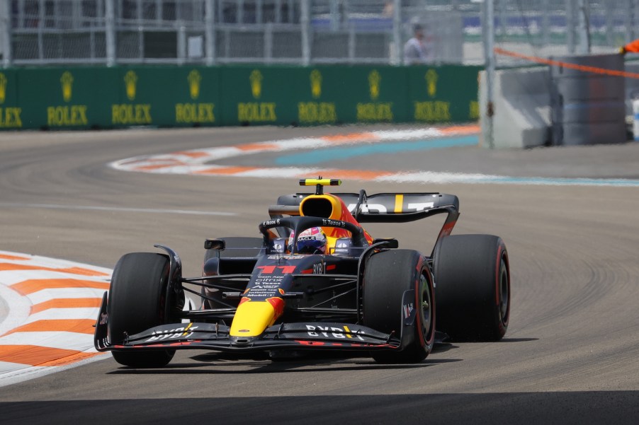 Sergio "Checo" Pérez's Formula One car circling a race track.