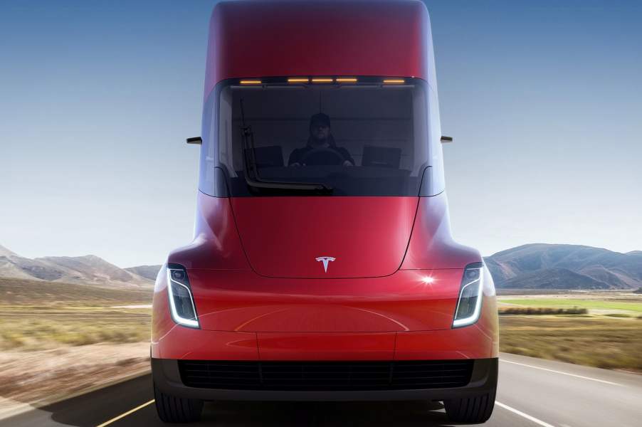 A man drives a Tesla semi truck, which can be reserved for $20,000