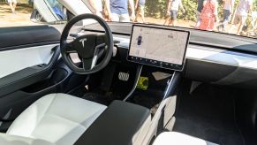 The inside of a Tesla displaying the Tesla screen.