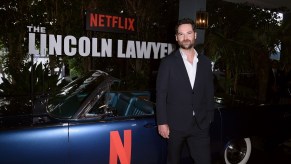 Manuel Garcia-Rulfo poses with a Netflix Lincoln Continental.