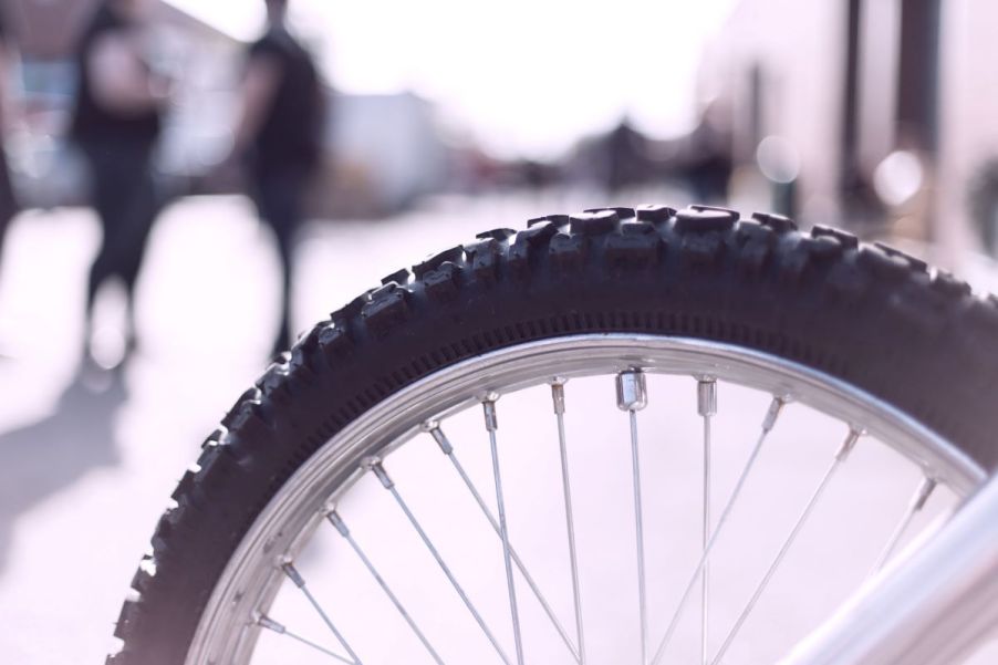 Close-up of a heavily treaded bike tire. Cordless tire inflators work on more than just car tires.