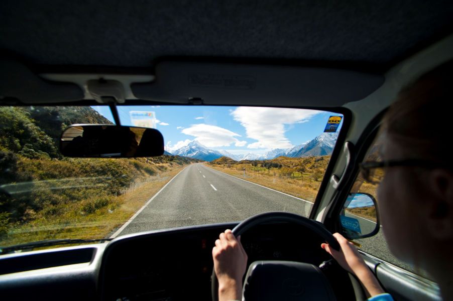 A man driving an RV motorhome to Aoraki Mount Cook in New Zealand