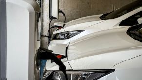 An electric vehicle garage wall charger in a city centre car park in Bath, England