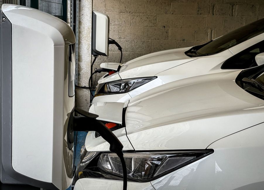 An electric vehicle garage wall charger in a city centre car park in Bath, England