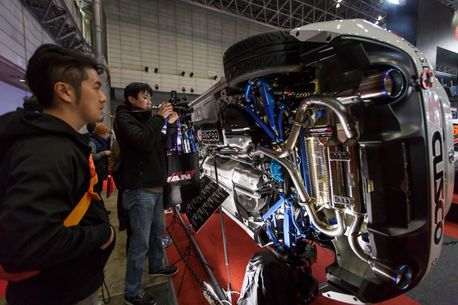 Visitors look at a aftermarket exhaust system.