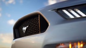 Grille of a silver Ford Mustang