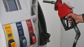 A fuel dispenser at a gas station pump concerning gas prices and fuel economy