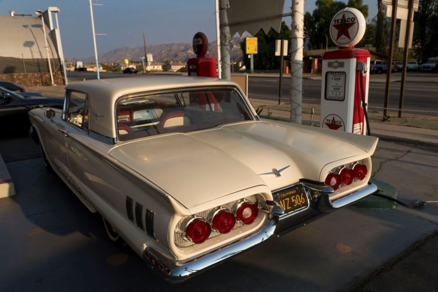 Premium fuel filling up a 1958 Thunderbird at a vintage gas station in Fillmore, California