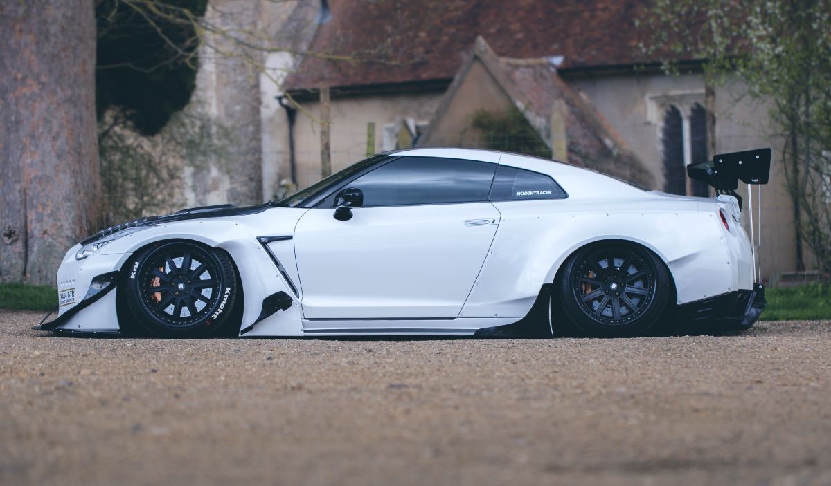 Heavily modified white Nissan GTR Rocket Bunny car