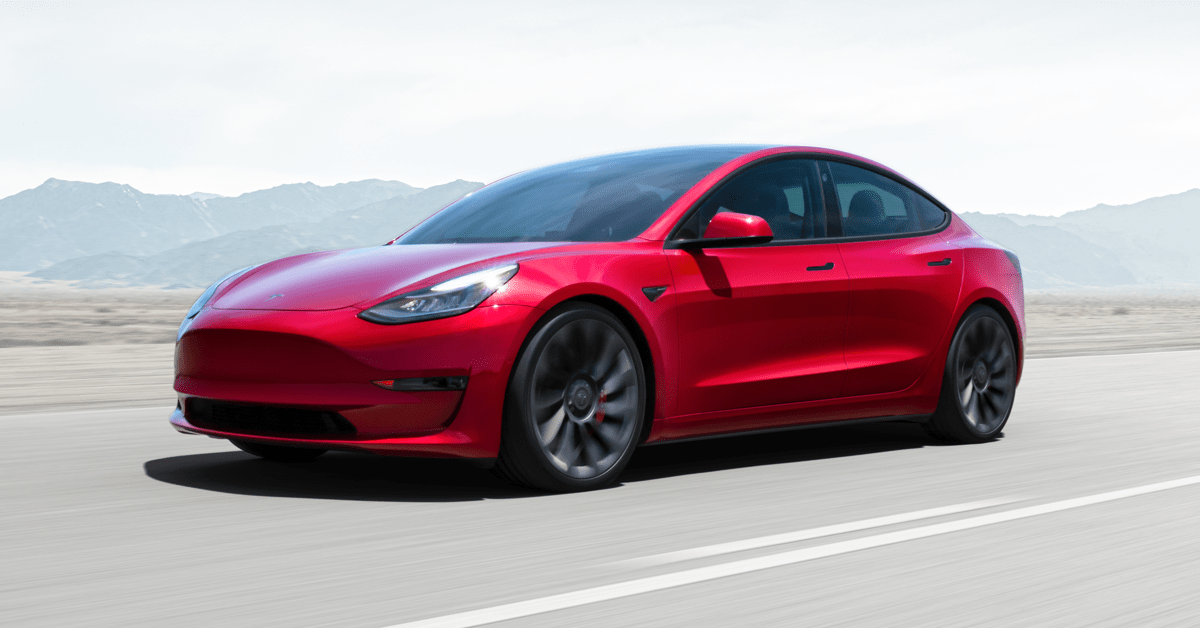 Red Tesla Model S EV luxury sedan parked on pavement. The Tesla Model 3 is one of the best used luxury electric cars