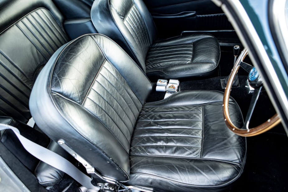 Black leather seats in an old classic car. Water stains on car seats can be frustrating, but they can be removed