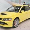 A yellow 2006 Mitsubishi Lancer Evolution IX.