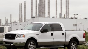 A white 11th generation Ford truck sits outside a factory in Michigan