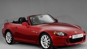 A red 2007 Honda S2000 coupe convertible model featured from the National Motor Museum