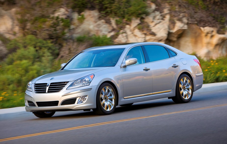 A silver 2011 Hyundai Equus full-size sedan driving down a canyon road