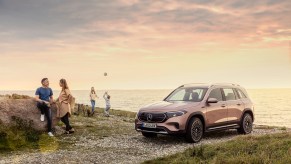 A Mercedes EQB at the beach in rose gold