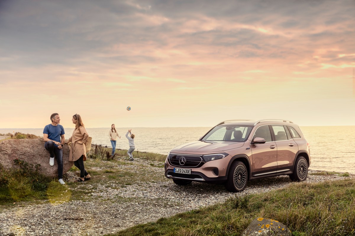 A Mercedes EQB at the beach in rose gold