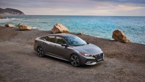 a gray 2020 nissan sentra parked overlooking the ocean, a stylish and upscale used compact sedan