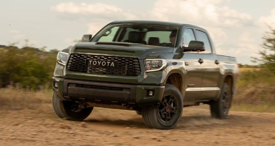 A gray 2020 Toyota Tundra kicking up dirt.