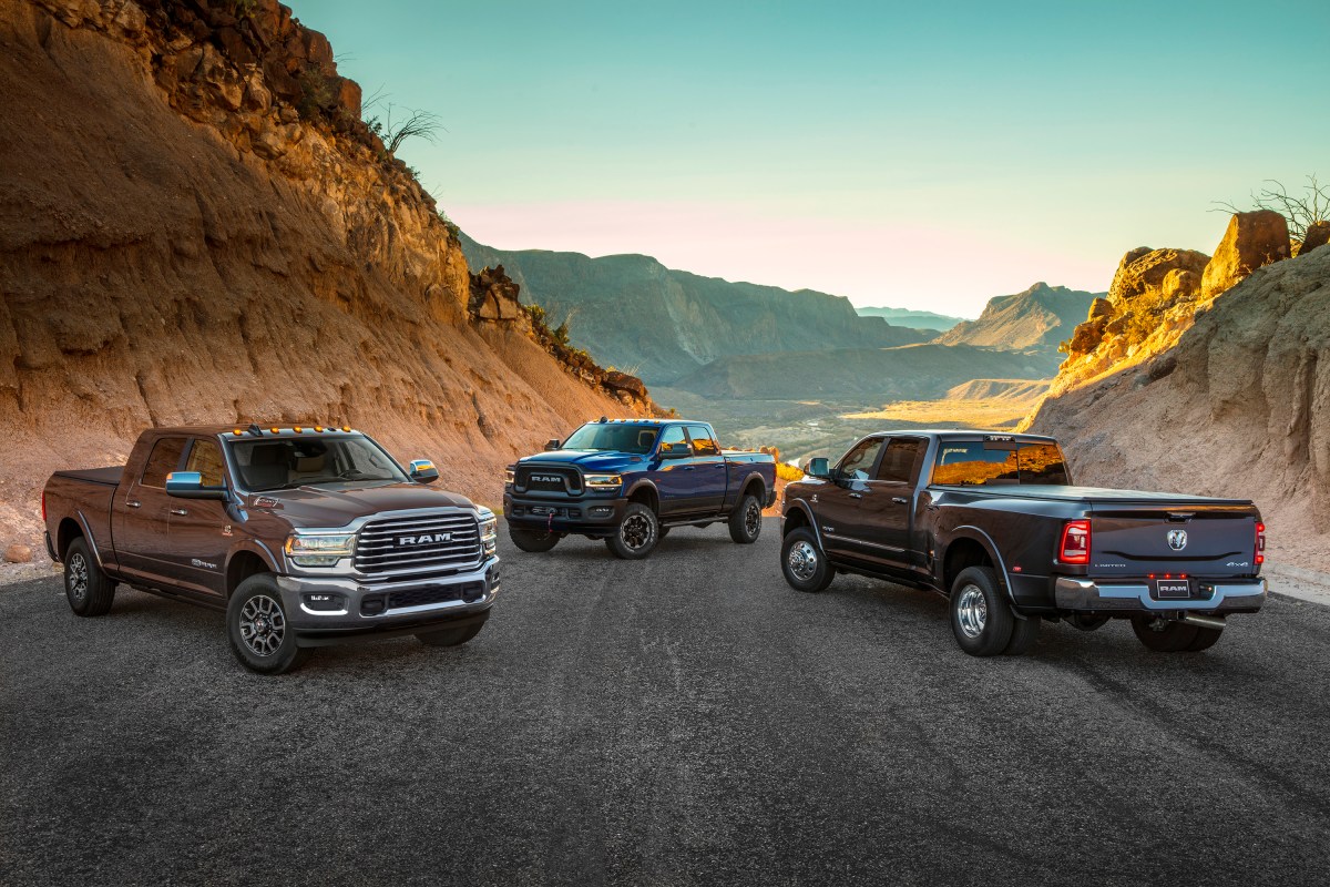 Three Ram heavy duty trucks on a mountain road. All but the Power Wagon can be ordered with a Cummins engine. 