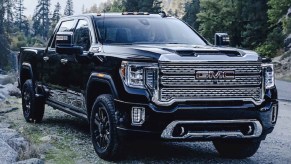 A black 2022 GMC Sierra 2500 in the woods.