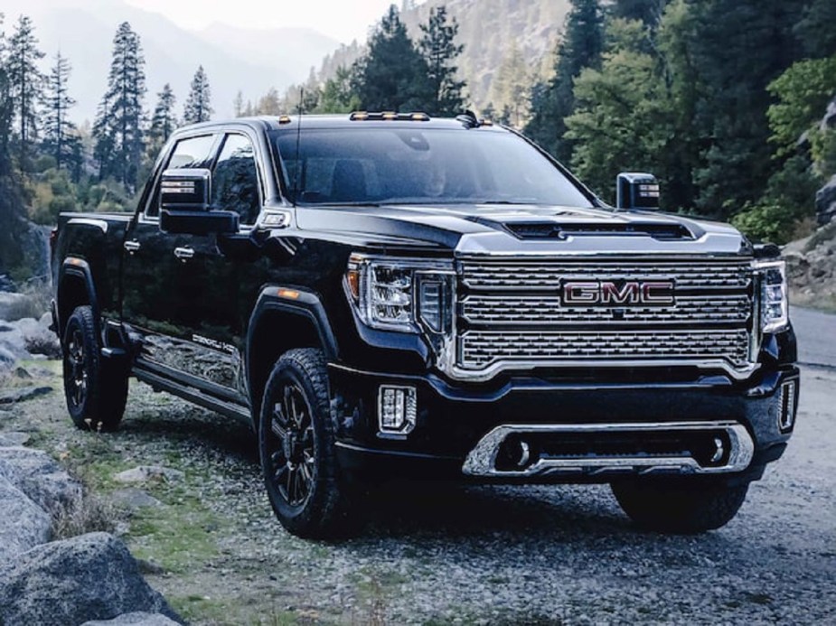 A black 2022 GMC Sierra 2500 in the woods.