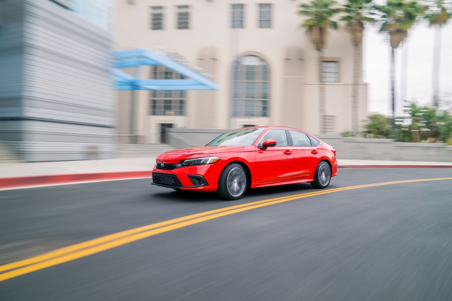 The 2022 Honda Civic, pictured here in a corner, goes toe-to-toe with the 2022 Kia Forte.