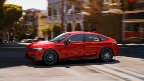 a red 2022 honda civic hatchback, one of the best new hatchbacks for 2022 with its performance and cargo space