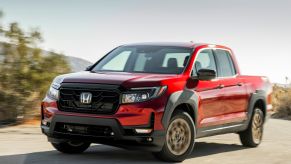 A red 2022 Honda Ridgeline parked outdoors.